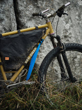 Load image into Gallery viewer, Blue rollable bicycle front fender made of recycled plastic on a gravel bike
