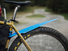 Load image into Gallery viewer, Blue rollable bicycle rear fender made of recycled plastic on a gravel bike