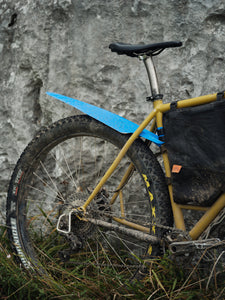 Blue rollable bicycle rear fender made of recycled plastic on a gravel bike